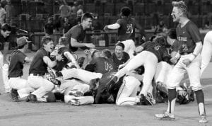 Dutch Fork celebrates its Class 5A Baseball State Championship with a dog pile. Photo by Jim Marczesky