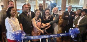 Tom’s Creek Market Xchange owners and staff, along with Carl Blackstone with the Columbia Chamber of Commerce, Richland County Councilman Derrek Pugh, Columbia City Councilman Tyler Bailey, and City of Columbia manager Teresa Wilson cut the ribbon to kick off Small Business Week.