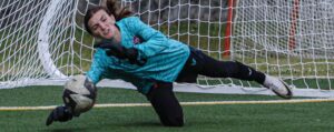 A.C. Flora keeper Kennedy Bagley warms up prior to the April 10 game against Dreher. Bagley has helped the Falcons post 14 of its 16 shut outs so far this year. Photo by Mike Maddock
