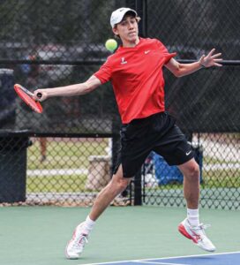 A.C. Flora No. 1 James Smyth rips a forehand in his match against Bishop England’s Dante Nava.