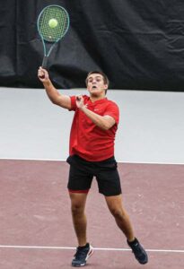 A.C. Flora No. 4 Will Hewitt slams an overhead in his match against Bishop England’s Parker Murphy.