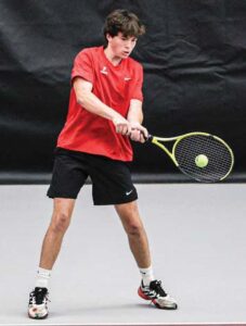 Will Trumpeter, A.C. Flora No. 2 doubles, hits a backhand against Bishop England.