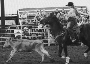 The cowgirls’ calf roping was tense to see the ropes taking the calf by the neck at the last moment before the bell.