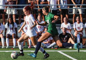 A.C. Flora’s Emma Valdes outruns Bishop England’s Sophia DeMarco.