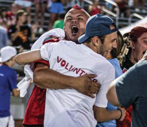 A.C. Flora head coach Eric Navarro celebrates with his assistant coaches.
