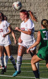 A.C. Flora’s Samantha Lawther heads the ball away from Bishop Englands’ Ava Delpino.