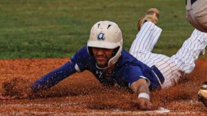 Airport’s Brice Gillette slides home safely during a two-run bottom of the third against Seneca.