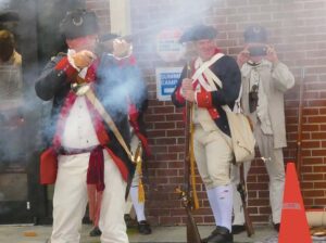 Instructor Dr. Erick Nason demonstrates the proper way to fire a long gun musket.