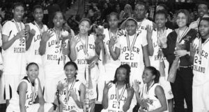 Morgan Stroman (standing far left) and the rest of the Lower Richland Diamond Hornets celebrate their fourth consecutive state championship.