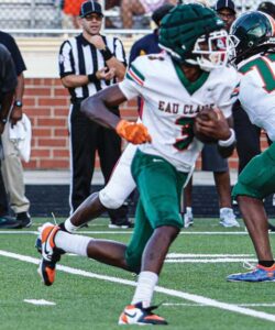 Eau Claire’s Josh Smith looks for running room against A.C. Flora.