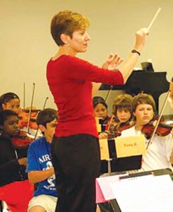 Gail Barnes conducting the orchestra. Photo contributed by the String Project