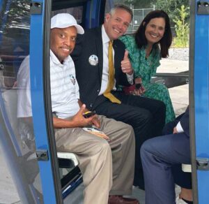 James Hammond (left), Mayor Daniel Rickenmann, and Deans Fawcett enjoy a ride on the Saluda Skyride.