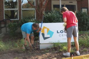 Chris Wormley and Rhett Allord weed and prepare the soil for the Lourie Center’s Monarch Waystation.