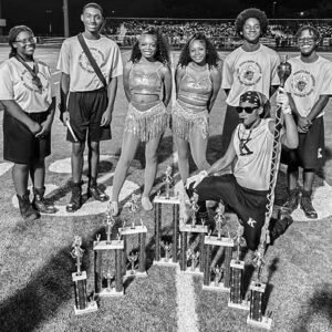 Members of W.J. Keenan High School’s Marching Keenan Raider Rubber Band with the band’s awards from the Spirit of the Cardinal Band Competition.