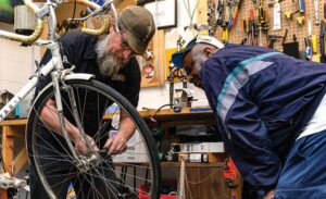 Scott Nuelken (l) makes a customer happy.