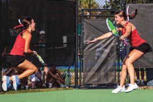 A.C. Flora’s Catherine and Emily Smith celebrate their win at No. 1 doubles over Gray Collegiate’s Morgan Horlback and Kate Snyder earning the Falcons the Class 4A Girls Tennis State Championship.