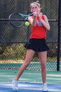 The A.C. Flora No. 2 doubles team of Stokely Haile and Ella Foley. Haile hits a forehand and Foley punches a backhand return.