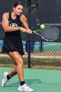 Gray Collegiate No. 4 Cecily Lokodi rips a backhand in her match against A.C. Flora’s Ruby Cecchini.