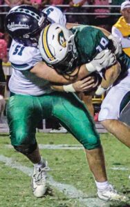 Heathwood Hall’s Xander Pertile gets a tackle against Ben Lippen. Photos by Mike Maddock