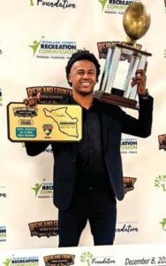 A.C. Flora’s Azel Banag receives a trophy and a $2,000 scholarship for being named Richland County High School Football Player of the Year.